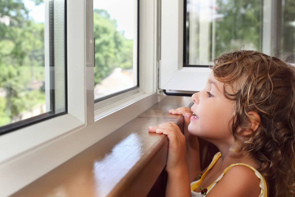 Young child looking out of window
